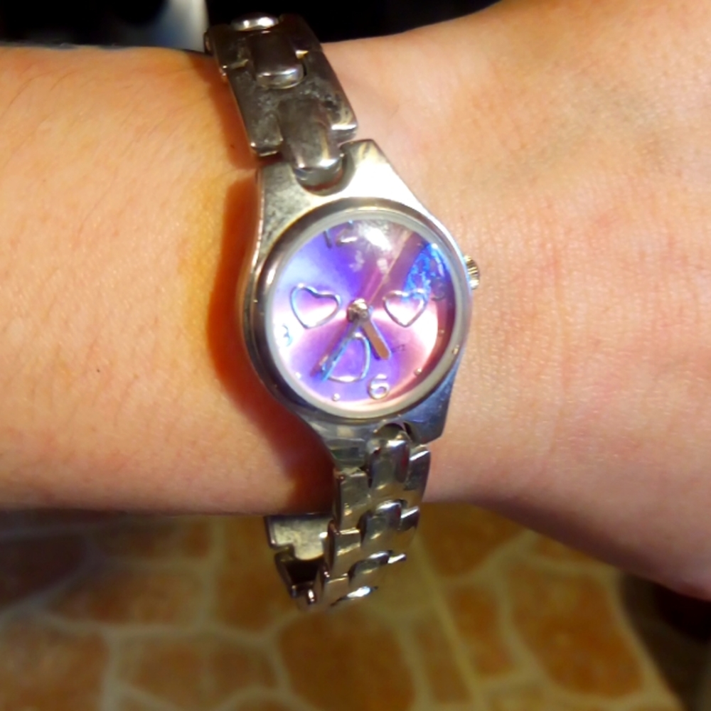Pink and silver quartz watch with hearts